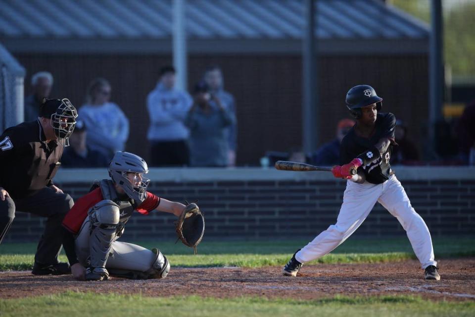 Tates Creek’s Jordan Huguely gets a base hit during the Commodores’ home game against Paul Laurence Dunbar on Wednesday. Huguely had an RBI in Tates Creek’s game-winning rally.