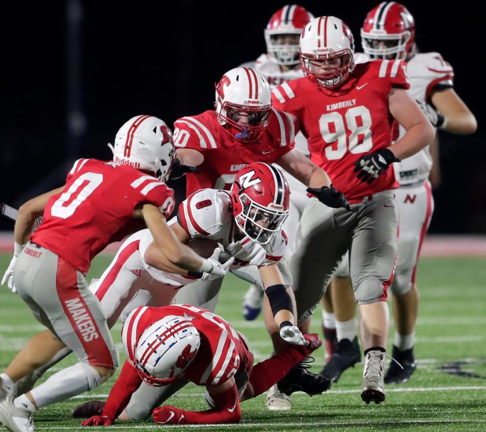 Neenah's Grant Dean (8) rushes against Kimberly during their football game Friday in Kimberly.
