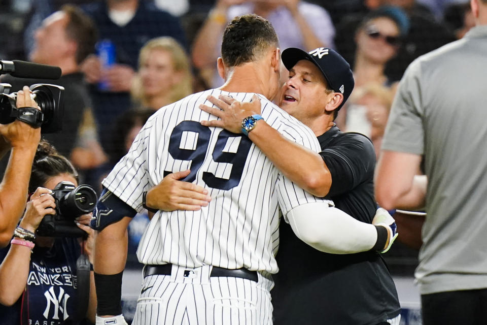 New York Yankees manager Aaron Boone, right, celebrates with Aaron Judge after Judge hit a walk-off home run during the ninth inning of a baseball game against the Kansas City Royals Thursday, July 28, 2022, in New York. The Yankees won 1-0. (AP Photo/Frank Franklin II)