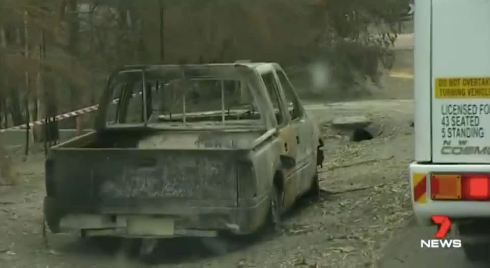 A burnt-out car on the side of the road. Source: 7 News