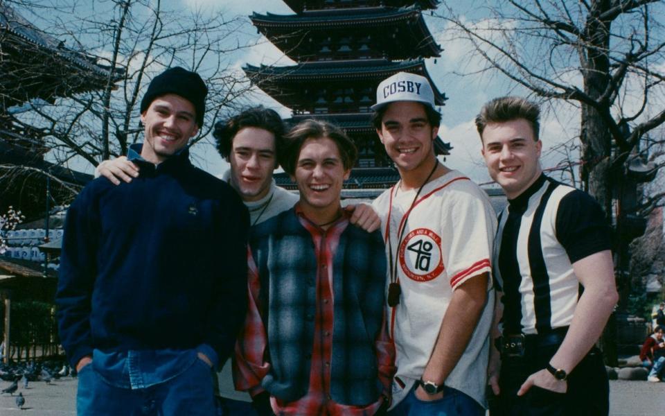 Williams (2r) with Take That in Japan in 1995, shortly before his first departure - Hulton Archive