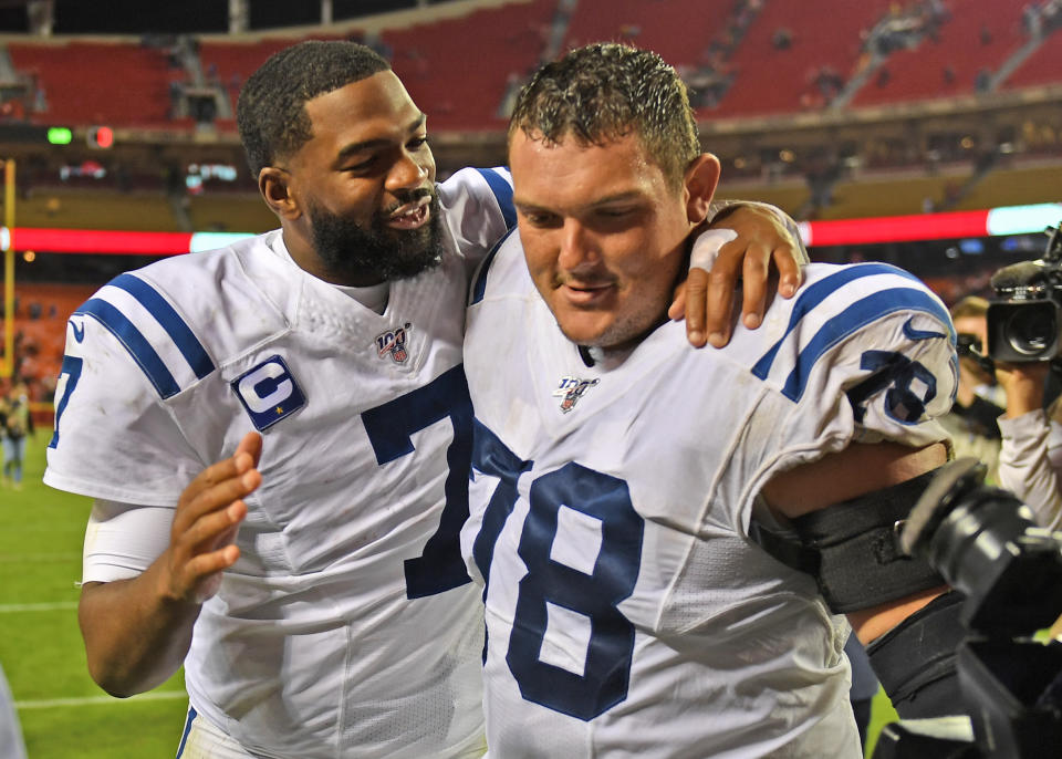 Colts center Ryan Kelly, right, was clear: if another player went after Jacoby Brissett, right, he'd protect the quarterback. (Peter Aiken/Getty Images)