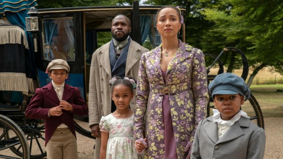 The Mondrich Family: Will Mondrich (Martins Imhangbe) and Alice Mondrich (Emma Naomi) and their children in "Bridgerton" Season 3 on Netflix