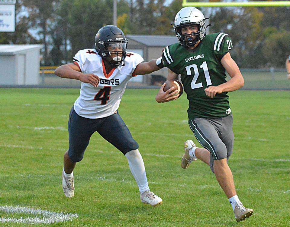 Clark-Willow Lake quarterback Emmerson Larson scrambles for yardage against Mobridge-Pollock's Mack Saxon during their high school football game on Friday, Sept. 22, 2023 in Clark.