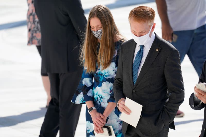 People pay respects as Justice Ruth Bader Ginsburg lies in repose under the Portico at the top of the front steps of the U.S. Supreme Court building