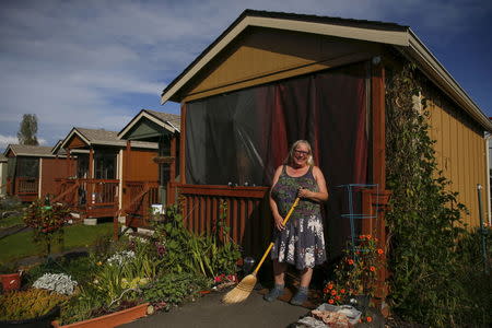 Sharon Wilson, 59, poses outside her cottage in Olympia, Washington October 11, 2015. REUTERS/Shannon Stapleton