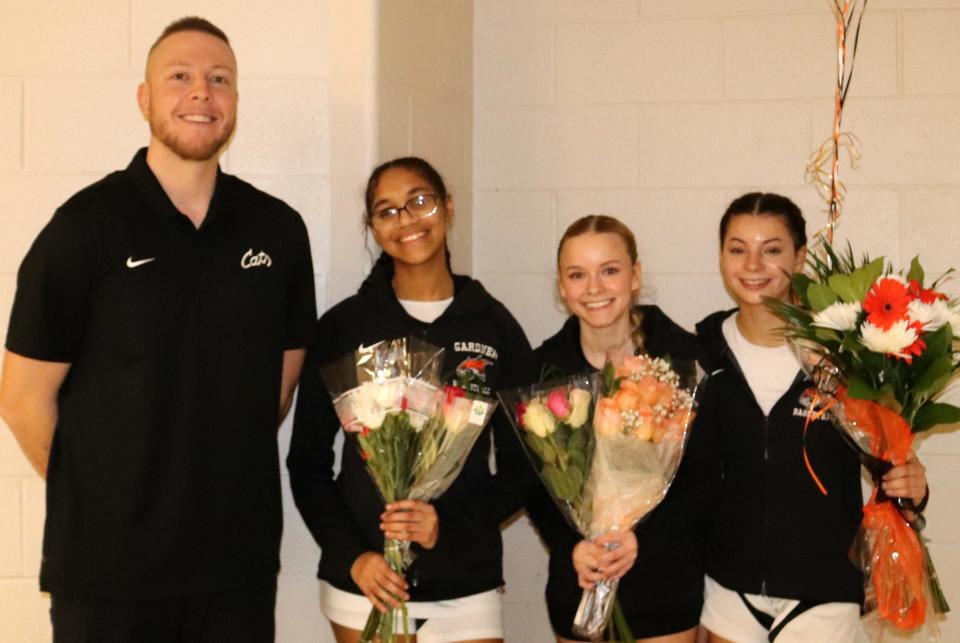 Gardner girls coach Francis Phillips with his three seniors: Zahara Vanderpuye, Haleigh Arsenault and Lydia Dupre. Gardner celebrated senior night for both of its basketball teams on February 12, 2024.