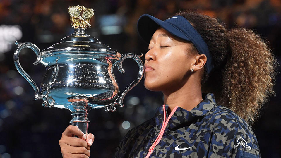 Seen here, Naomi Osaka kisses the Australian Open trophy after her win in the final.