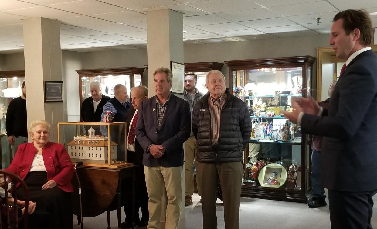 The city of Portsmouth held a reception to honor Rep. Laura Pantelakos (seated, at left) before the City Council meeting on Monday, Oct. 3, 2022. Mayor Deaglan McEachern, at right, makes remarks honoring Pantelakos' longtime service to the city in both state and municipal office.