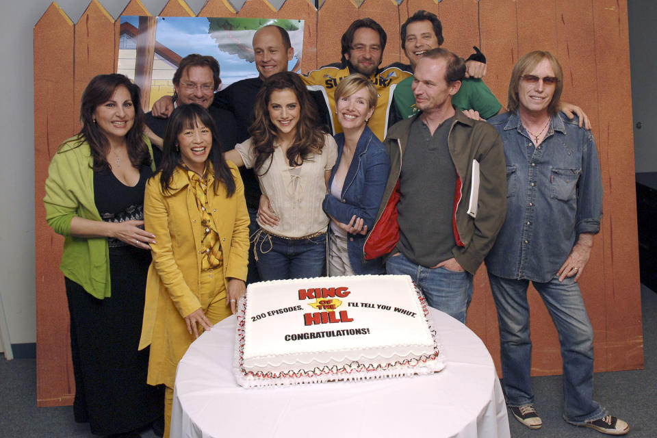 (Back row, L-R:)  Kathy Najimy as Peggy Hill, Stephen Root as Bill, creator and exec. producer Mike Judge as Hank Hill, guest voice David Herman, Johnny Hardwick as Dale, and (front row L-R:) Lauren Tom as Mihn, Brittany Murphy as LuAnne, Ashley Gardner as Nancy Gribble, Toby Huss as Cotton/Kahn and guest voice Tom Petty as Lucky celebrate the 200th episode of "King of the Hill" in Century City, CA on April 8, 2005 (Photo by Ray Mickshaw/WireImage)
