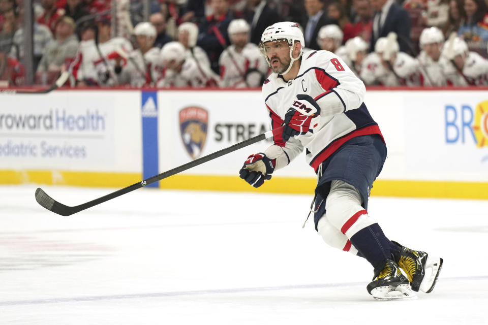 Washington Capitals left wing Alex Ovechkin (8) follows the puck against the Florida Panthers during the first period of an NHL hockey game Thursday, Feb. 8, 2024, in Sunrise, Fla. (AP Photo/Jim Rassol)
