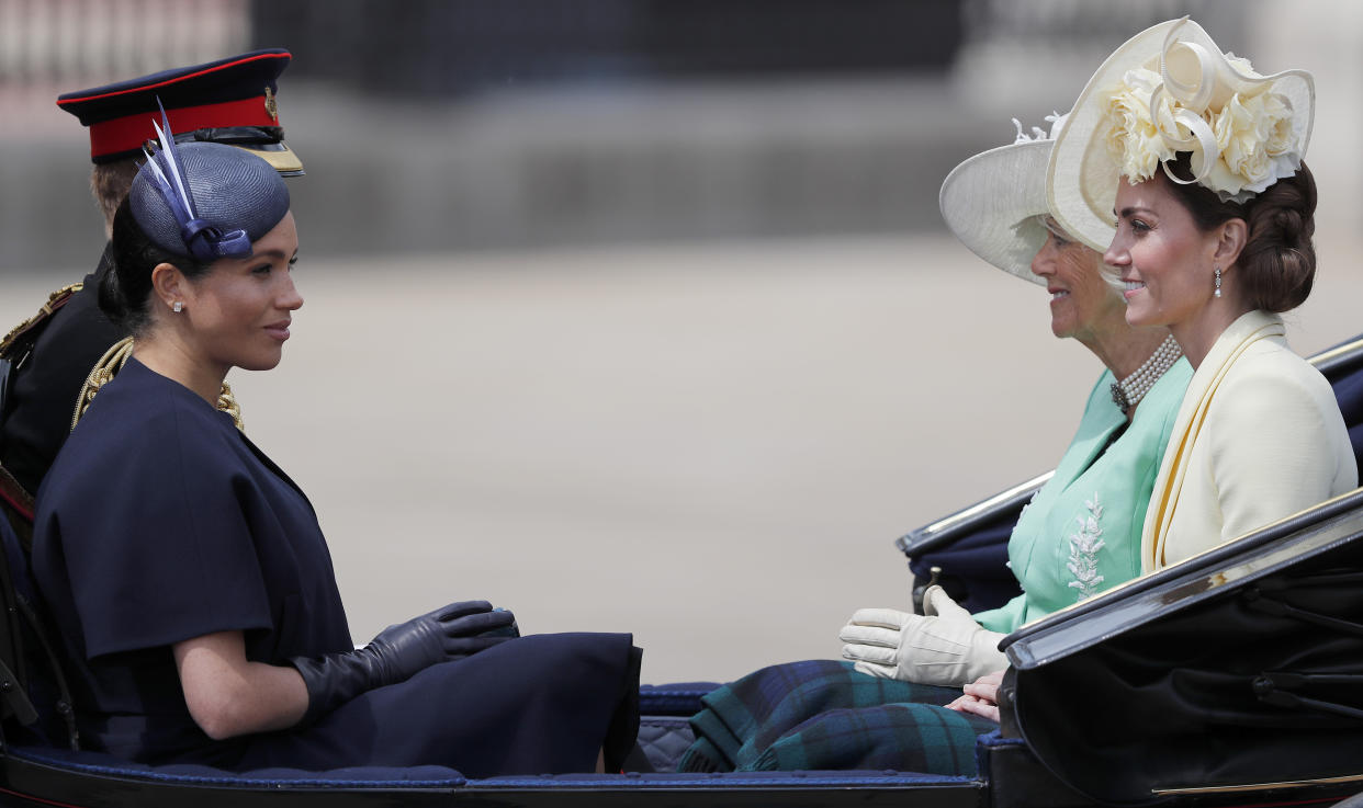 FILE - Britain's Camilla, the Duchess of Cornwall, far right, Kate, the Duchess of Cambridge, right, Prince Harry, rear left, and Meghan, the Duchess of Sussex ride in a carriage to attend the annual Trooping the Colour Ceremony in London, Saturday, June 8, 2019. King Charles III will hope to keep a lid on those tensions when his royally blended family joins as many as 2,800 guests for the new king’s coronation on May 6 at Westminster Abbey. All except Meghan, the Duchess of Sussex, who won’t be attending. (AP Photo/Frank Augstein, File)