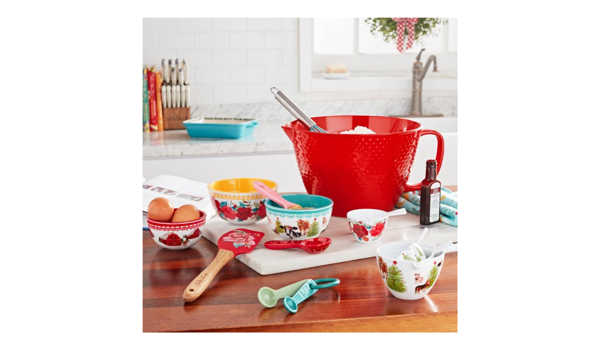 Kitchen counter with 14-piece baking set items displayed in use.