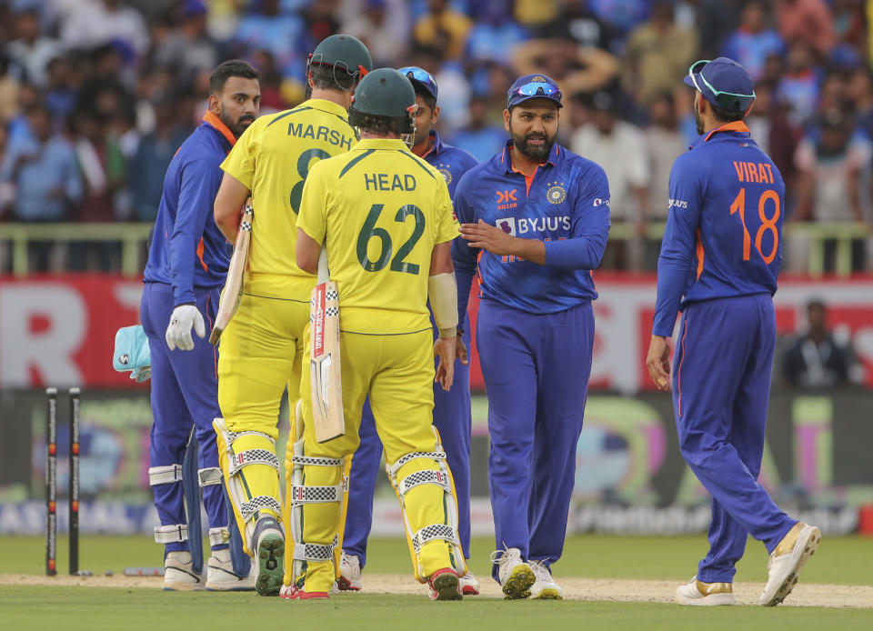 Australian and Indian players player shake hands at the end of the second one-day international cricket match between India and Australia, in Visakhapatnam, India, Sunday, March 19, 2023. (AP Photo/Surjeet Yadav)