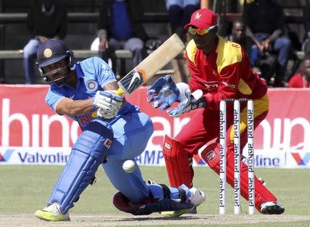 Indian cricket batsman Manish Pandey plays a shot during their third One Day International cricket match against Zimbabwe in Harare, July 14, 2015. REUTERS/Philimon Bulawayo/Files