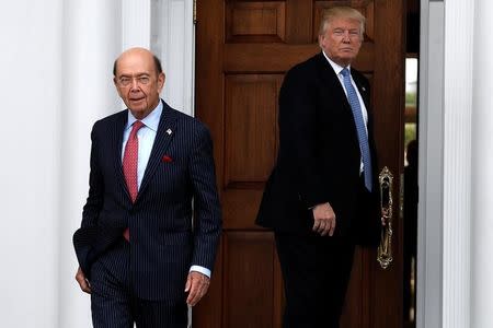 U.S. President-elect Donald Trump looks on as Wilbur Ross departs after their meeting at Trump National Golf Club in Bedminster, New Jersey, U.S., November 20, 2016. REUTERS/Mike Segar