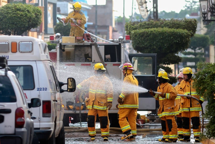 Firefighters work at the Jose Cuervo tequila factory on July 24, 2024, a day after an explosion occurred during maintenance works at the facility in the Tequila municipality, Jalisco State, Mexico. The explosion at the factory producing Jose Cuervo tequila killed at least five people on July 23, local authorities said. It was not yet known what caused the blast, with the company saying it happened during maintenance work. It impacted four containers with a capacity of 219,000 litres each, two of which collapsed, said Victor Hugo Roldan, state director of civil protection. (Photo by ULISES RUIZ / AFP) (Photo by ULISES RUIZ/AFP via Getty Images)