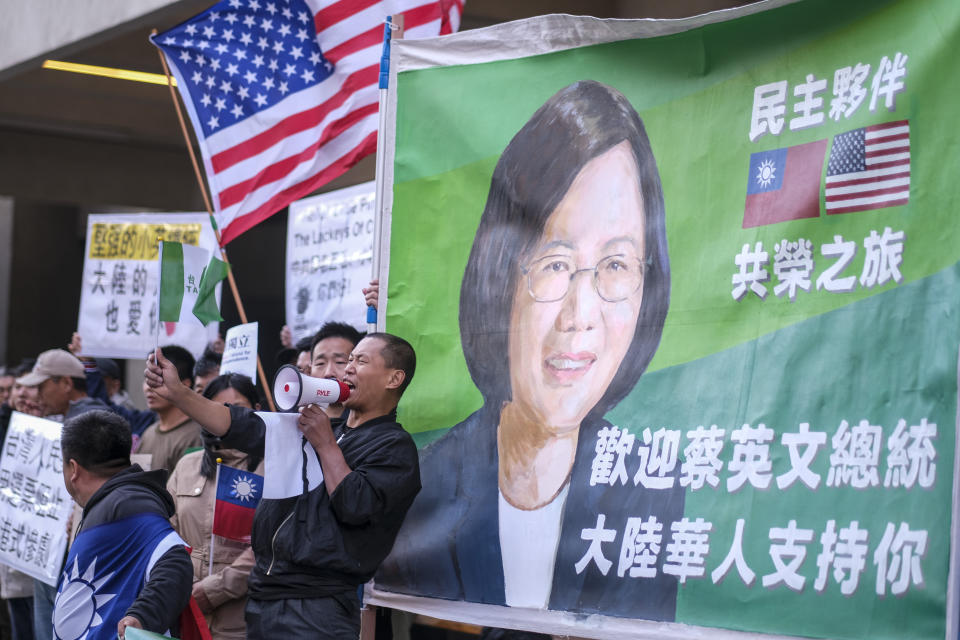 Supporters of Taiwan gather outside a hotel where Taiwanese President Tsai Ing-wen is expected to arrive in Los Angeles Tuesday, April 4, 2023. (AP Photo/Ringo H.W. Chiu)