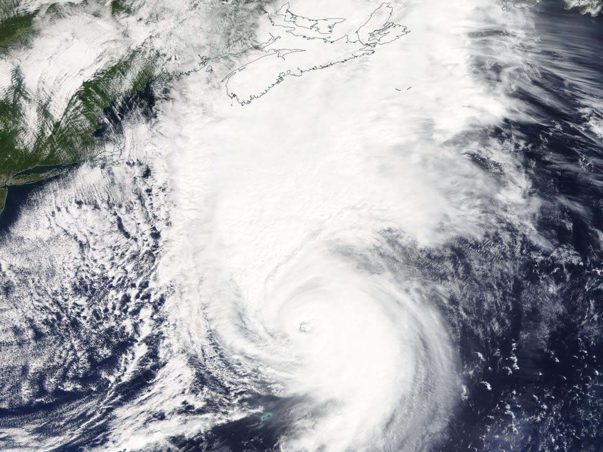 Hurricane Fiona approaches Nova Scotia in this satellite photo taken Friday. Sable Island is seen to the lower right of the province, appearing as two little lines to the southeast of Cape Breton Island. (NASA - image credit)