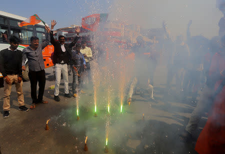 FILE PHOTO: Supporters of India's ruling Bharatiya Janata Party (BJP) light fireworks to celebrate after Indian authorities said their jets conducted airstrikes on militant camps in Pakistani territory, in Prayagraj, India, February 26, 2019. REUTERS/Jitendra Prakash/File Photo