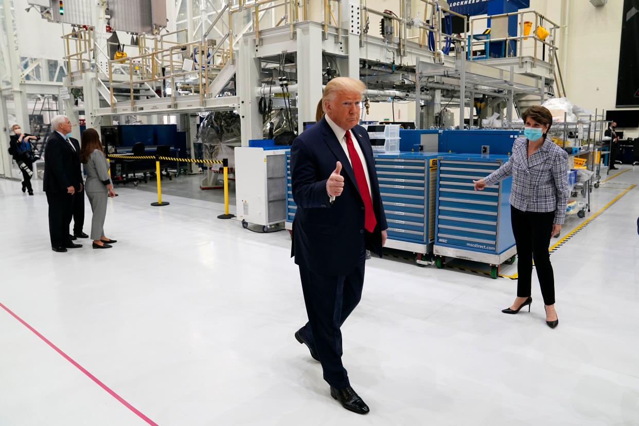 President Donald Trump tours NASA facilities with Lockheed Martin CEO Marillyn Hewson before the scheduled SpaceX launch Wednesday at Kennedy Space Center in Cape Canaveral, Fla. The Wednesday launch was scrubbed. (Evan Vucci/ASSOCIATED PRESS)