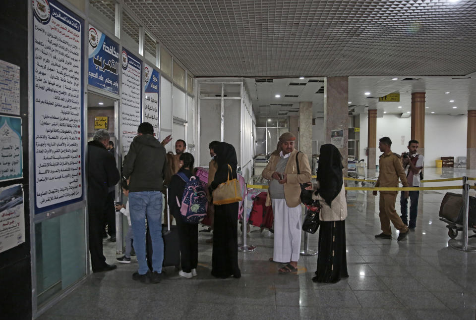 Yemenis queue at the departure lounge to board the first commercial flight at Sanaa airport, Yemen, Monday, May 16, 2022. The first commercial flight in six years took off from Yemen’s rebel-held capital on Monday, officials said, part of a fragile truce in the county’s grinding civil war.(AP Photo/Hani Mohammed)