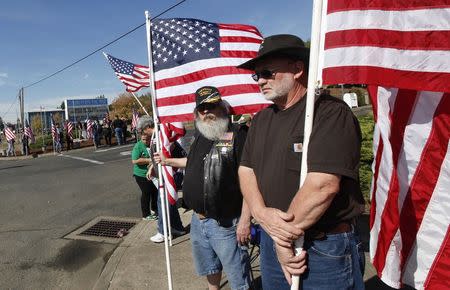 Supporters line the street outside the Church on the Rise as people arrive at the funeral service of Umpqua Community College student Jason Johnson in Roseburg, Oregon October 8, 2015. REUTERS/Amanda Loman