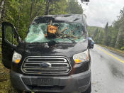 This image provided by Maine State Police shows the vehicle of an Ohio driver who suffered minor injuries Saturday, Sept. 16 2023 after tree downed by the remnants of tropical storm Lee went through his windshield on Route 11 in Moro Plantation, Maine, according to Maine State Police. John Yoder, 23, of Apple Creek, Ohio attempted to stop but couldn’t avoid the tree. Yoder suffered minor cuts but the other five passengers in the van were not injured. Police blamed high winds for the downed tree. (Maine State Police via AP)