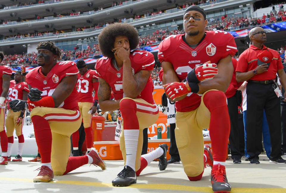 Eric Reid, right, has been a friend an ally of Colin Kaepernick's throughout his ordeal with the NFL. (Thearon W. Henderson/Getty Images)