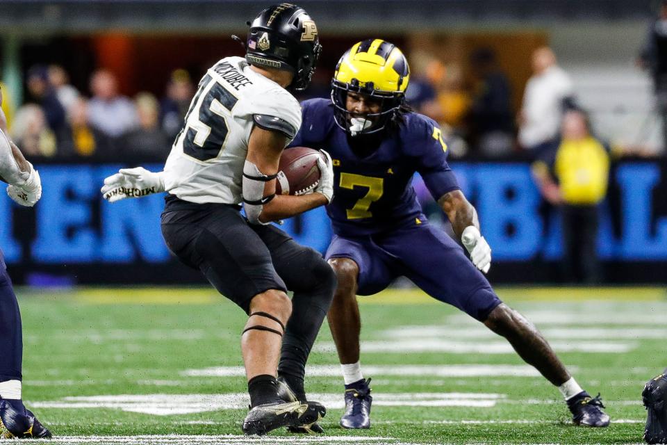 Michigan defensive back Makari Paige (7) looks to tackle Purdue running back Devin Mockobee (45) during the second half of the Big Ten Championship game at Lucas Oil Stadium in Indianapolis, Ind., on Saturday, Dec. 3, 2022.