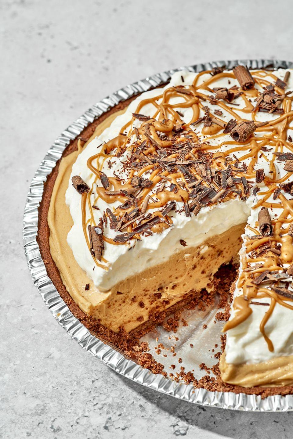 fluffernutter pie in a metal pie tin with a slice taken out