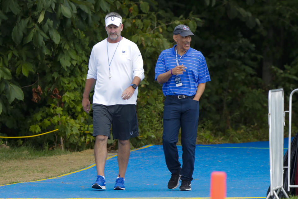 Indianapolis Colts head coach Frank Reich walks to the field with former Colts coach Tony Dungy practice at the NFL team's football training camp in Westfield, Ind., Thursday, Aug. 15, 2019. The Colts held a joint practice with the Cleveland Browns. (AP Photo/Michael Conroy)