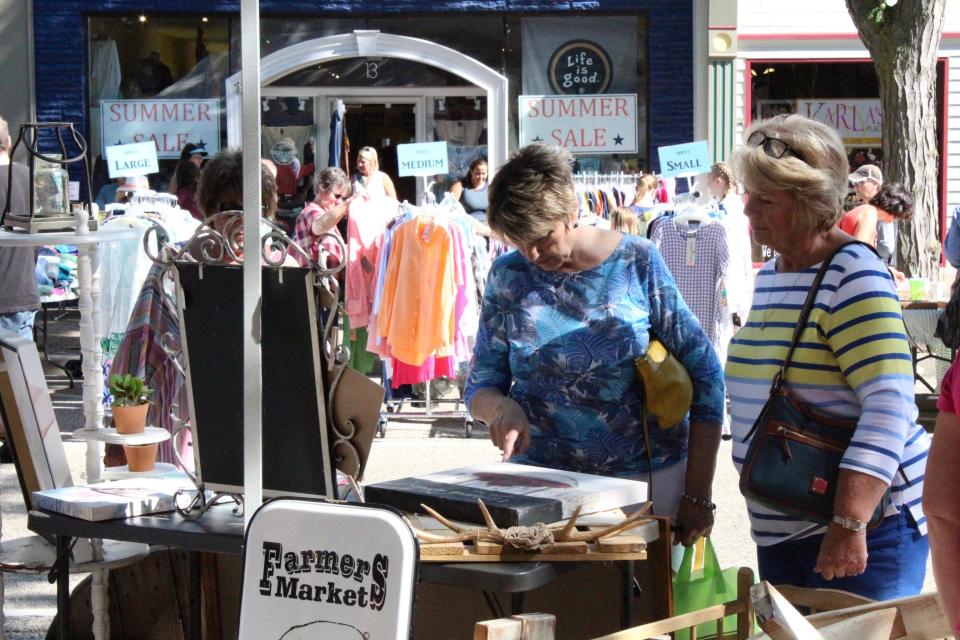 Nearly 60 businesses participated in a Holland Sidewalk Sales event downtown.