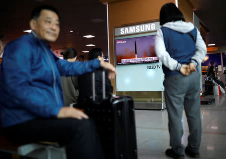 People watch a TV broadcasting of a news report on North Korea's missile launch, at a railway station in Seoul, South Korea, April 29, 2017. REUTERS/Kim Hong-Ji