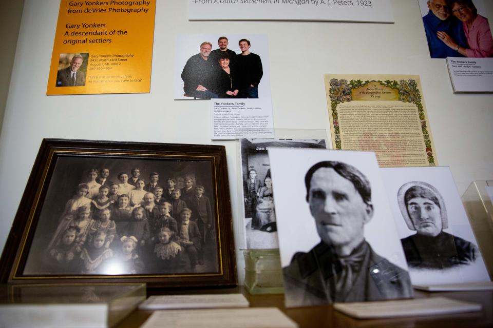 Portraits of the first settlers of Zeeland sit amongst their descendants as part of an exhibit showcasing the town's past and present Thursday, July 14, 2022, at the Dekker Huis Museum in downtown Zeeland.