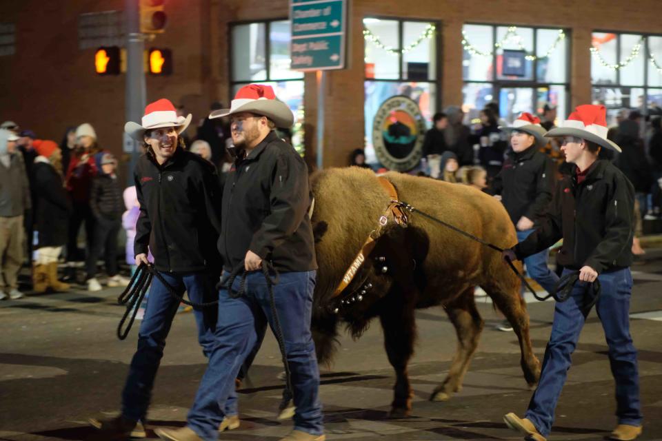 The WT Herdsman lead Thunder down the road during the Parade of Lights in downtown Canyon.