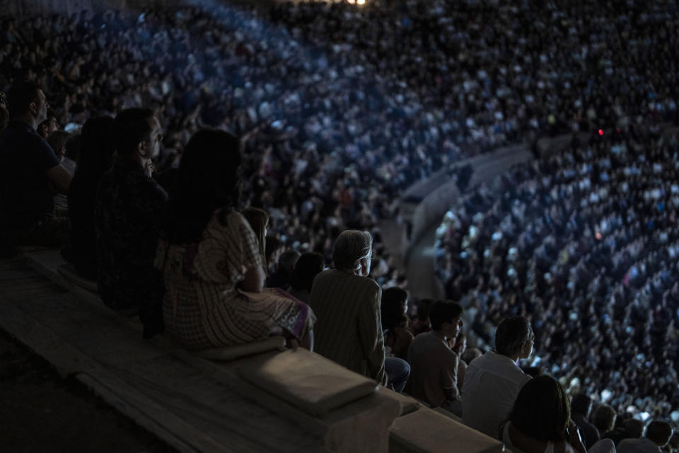 Spectators watch a performance of "Madame Butterfly" at the Odeon of Herodes Atticus in Athens, on Thursday, June 1, 2023. The annual arts festival in Athens and at the ancient theater of Epidaurus in southern Greece is dedicated this year to the late opera great Maria Callas who was born 100 years ago. (AP Photo/Petros Giannakouris)