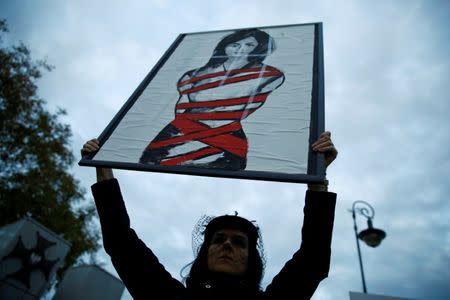 A woman holds a placard as she takes part in an abortion rights campaigners' demonstration in front of the Parliament in Warsaw, Poland September 22, 2016. REUTERS/Kacper Pempel