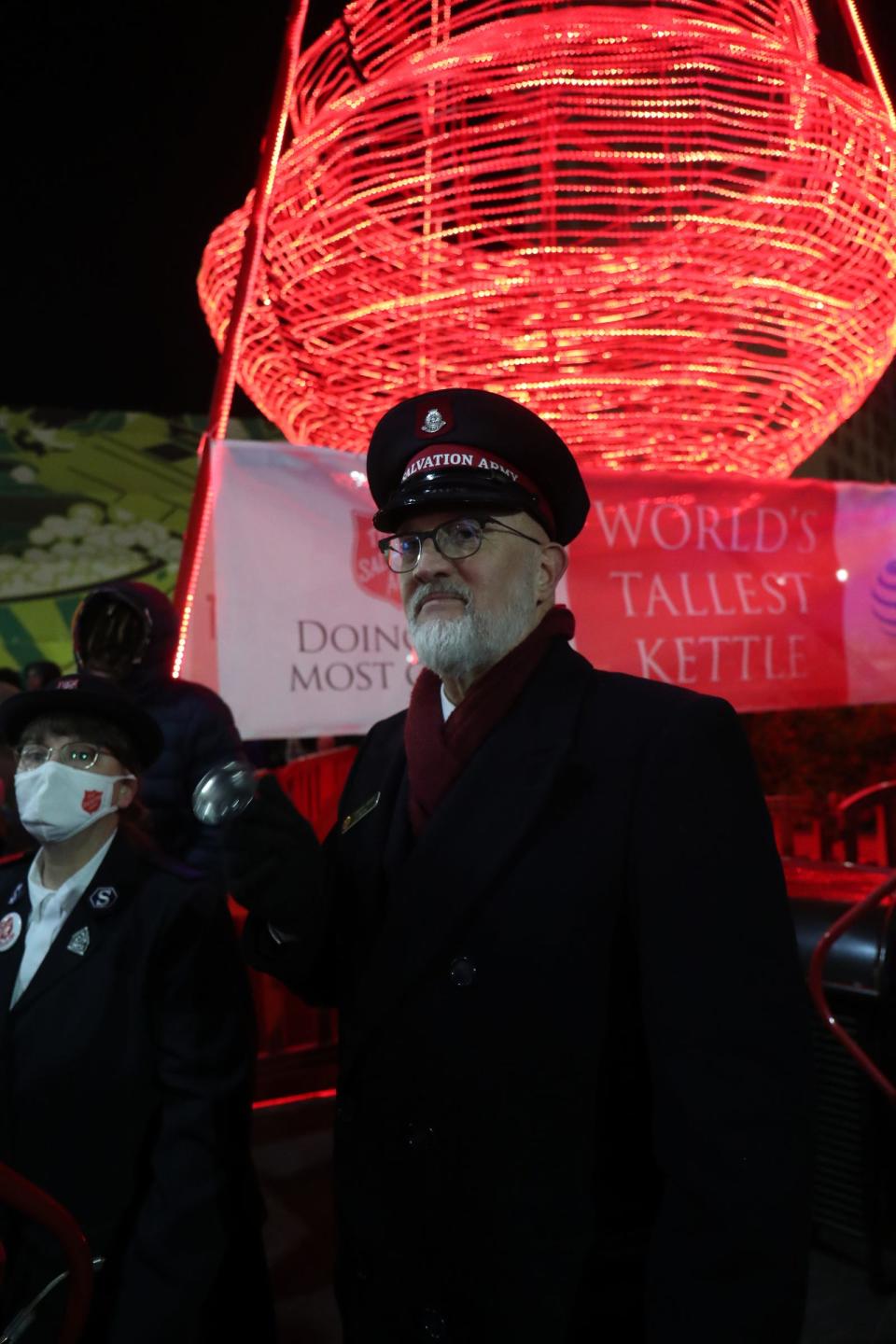 Maj. Tim Meyer rings his bell in front of the giant Salvation Army kettle during the annual Christmas tree lighting at Campus Martius on Nov.19, 2021. The event featured food trucks and entertainment on the ice rink and stage.