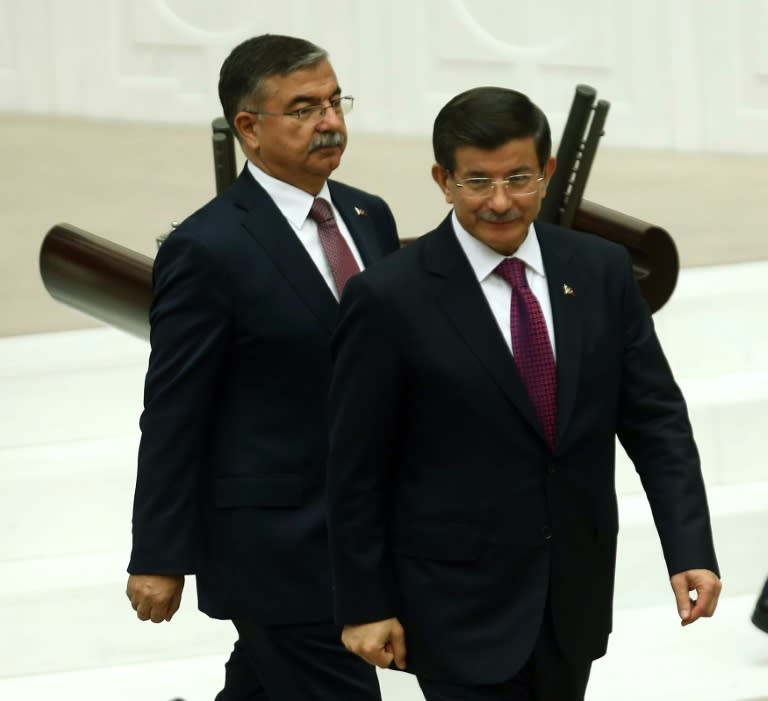 Turkish Prime Minister Ahmet Davutoglu (right) and Parliament Speaker Ismet Yilmaz at the National Assembly in Ankara, on July 1, 2015