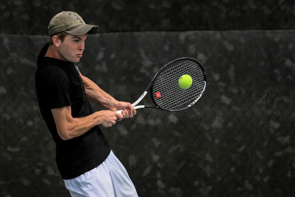 Sioux Falls Lincoln's Gage Gohl returns a serve in flight 1 singles action during day one of the Class AA state tournament on Thursday at Sioux Park in Rapid City.