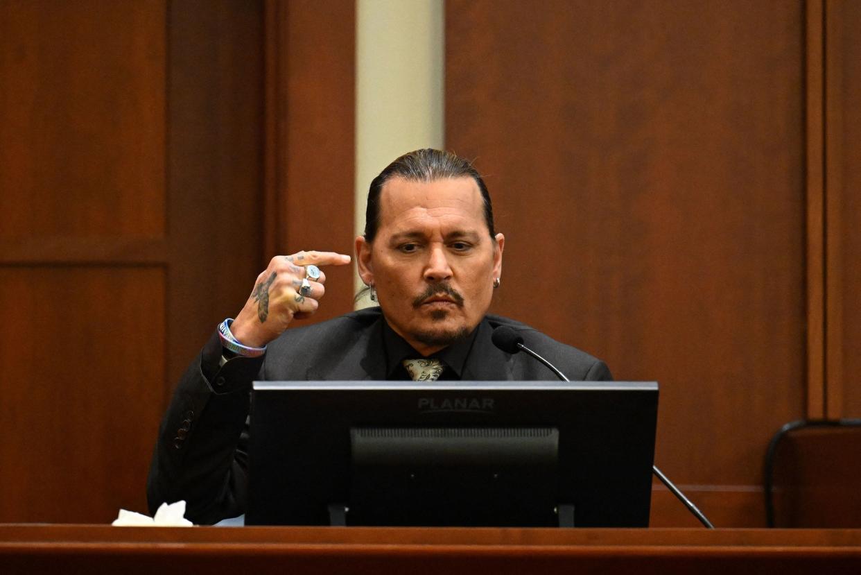 Johnny Depp testifies during his defamation trial in the Fairfax County Circuit Courthouse in Fairfax, Virginia on April 19, 2022.