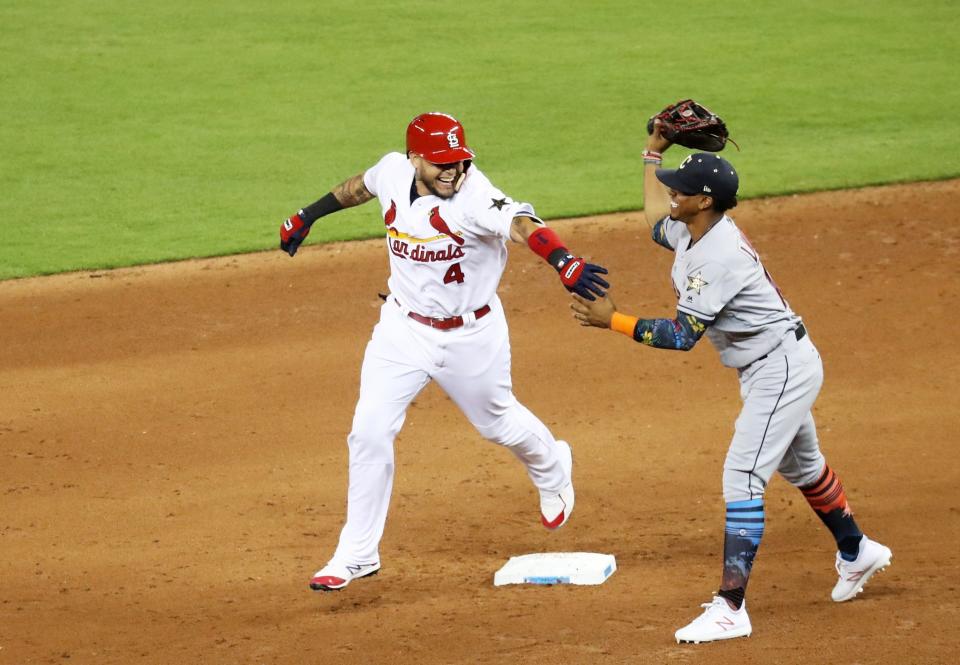 <p>Yadier Molina #4 of the St. Louis Cardinals and the National League jokes with Francisco Lindor #12 of the Cleveland Indians and the American League as he runs the bases after hitting a solo home run in the sixth inning during the 88th MLB All-Star Game at Marlins Park on July 11, 2017 in Miami, Florida. (Photo by Rob Carr/Getty Images) </p>