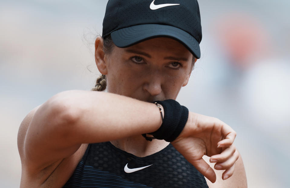 Belarus's Victoria Azarenka p wipes her face as she plays against United Staes's Madison Keys during their third round match on day 6, of the French Open tennis tournament at Roland Garros in Paris, France, Friday, June 4, 2021. (AP Photo/Thibault Camus)