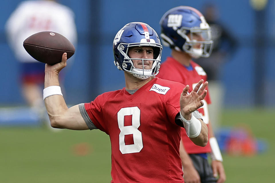 FILE - New York Giants quarterback Daniel Jones passes during the NFL football team's practice on Wednesday, June 14, 2023, in East Rutherford, N.J. Quarterback Daniel Jones reaped the financial rewards of a career season and now must show he's worth $40 million annually. (AP Photo/Adam Hunger, File)