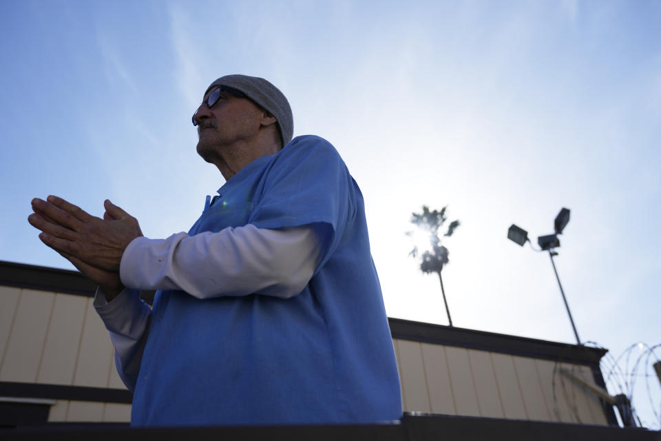 Michael Moore, who takes part in the Peer Literacy Mentor Program, stands outside his classroom at San Quentin State Prison in San Quentin, Calif., Friday, March 17, 2023. Gov. Gavin Newsom plans to transform San Quentin State Prison, a facility in the San Francisco Bay Area known for maintaining the highest number of prisoners on death row in the country. Newsom said his goal is to turn the prison into a place where inmates can be rehabilitated and receive job training before returning to society. (AP Photo/Eric Risberg)