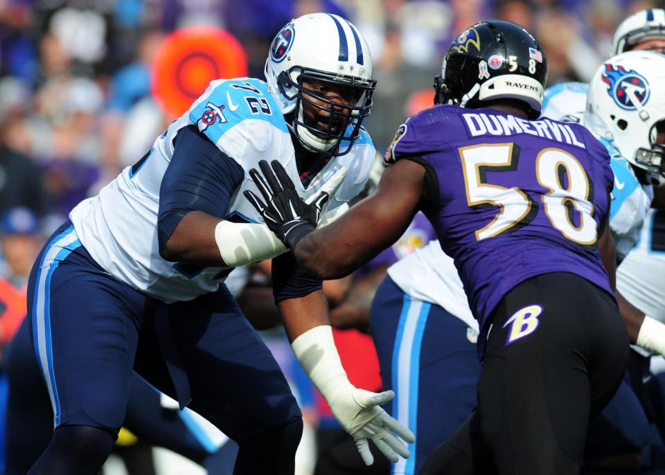 Titans offensive tackle Michael Oher (72) blocks  Ravens linebacker Elvis Dumervil (58) on Nov. 9, 2014.
