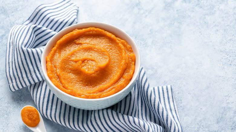 Carrot purée in white bowl