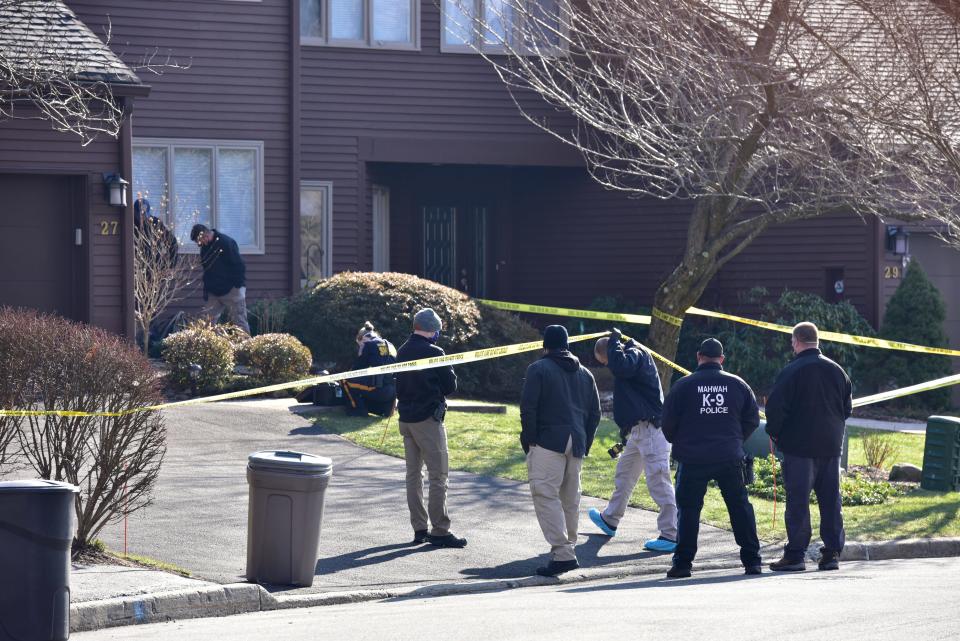 Mahwah Police and Bergen County Sheriff's Office conduct an investigation at a townhouse on Indian Field Court in Mahwah, N.J. on Tuesday Jan. 12, 2021. A Bergen County Medical Examiner's vehicle was also at the scene. 