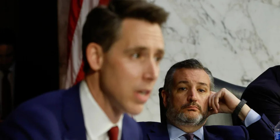 Sen. Ted Cruz of Texas looks on as Sen. Josh Hawley of Missouri speaks at a hearing on Capitol Hill on March 22, 2022.